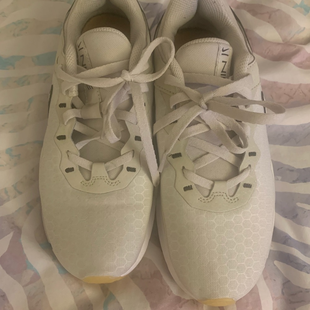 Beige and leopard Nikes.